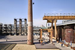 People walking around site with industrial features