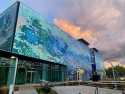 Parking garage with moving mural made of KINETICWALL panels