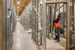 A suite of slide-in modular bathrooms for a large-scale hospital project in various stages of completion.