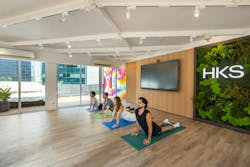 HKS Singapore Office, Singapore, Asia. The Learning Center offers adaptable space, easily configured for events, client meetings, exhibitions, and even yoga sessions. It fosters community connections while showcasing HKS's influence and involvement
