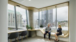 Davis Wright Tremaine, Portland, Ore. Continuous curved wood casework creates both seating and workstations.