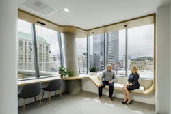 Davis Wright Tremaine, Portland, Ore. Continuous curved wood casework creates both seating and workstations. Davis Wright Tremaine, Portland, Ore. Continuous curved wood casework creates both seating and workstations.