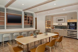 Perkins Coie, Phoenix, Ariz. The amenities within this work café are organized and efficient, integrated into custom millwork which ties back to the organic aesthetic Perkins Coie, Phoenix, Ariz. The amenities within this work café are organized and efficient, integrated into custom millwork which ties back to the organic aesthetic