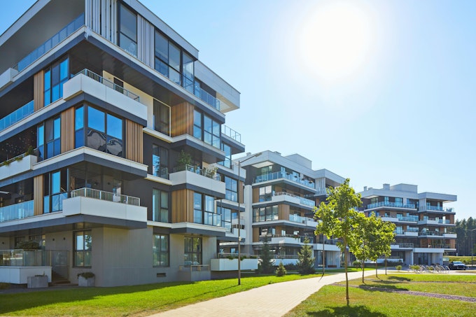 New modern block of flats in green area. residential apartment with flat buildings exterior. luxury house complex. Part of City Real estate property, condo architecture. apartment insurance concept