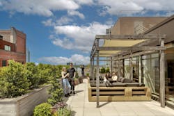 Rooftop terrace at office building workplace with people sitting outside