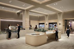 Office caf&eacute; and kitchen area with people talking
