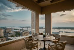 Walter P Moore transformed a 1960s Baton Rouge office building into the Residences at Rivermark, adding balconies and a rooftop pool. Structural upgrades allowed column-free layouts and amenities like hot tubs, fire pits, and grills. Photo &copy; Walter P Moore