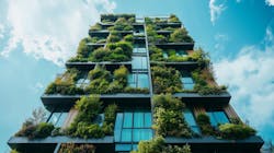 Innovative sustainable building adorned with lush greenery under a vibrant sky