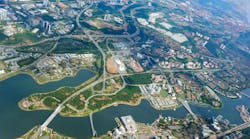 Overhead city view of Putrajaya. Aerial cityscape, Malaysia. Overhead city view of Putrajaya - Putra lake, Seri Saujana Bridge, Prime Minister`s Department Complex, Federal Government Administrative Centre, Putra Mosque.