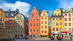 Stockholm, Sweden - July, 2018: Colorful facade of the houses in Stortorget Square Gamla Stan. Stockholm, Sweden with tourists at summer sunny day