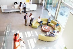 Reception Area Of Modern Office Building With People Overhead Shot Reception Area Of Modern Office Building With People Overhead Shot