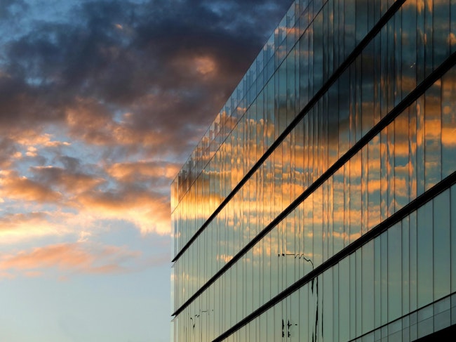 Modern Office Building. Modern glass office building with sunset reflection